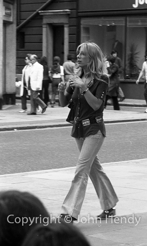 Ivana, walking by the Chelsea Drug Store via John Hendy photography
