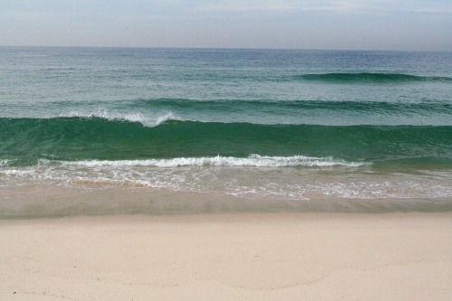 sandy beach, the sea is rolling in